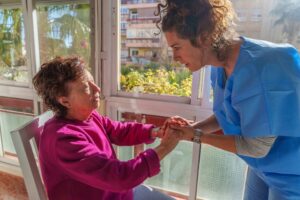 Long Term Care Nurse Comforting Elderly Patient