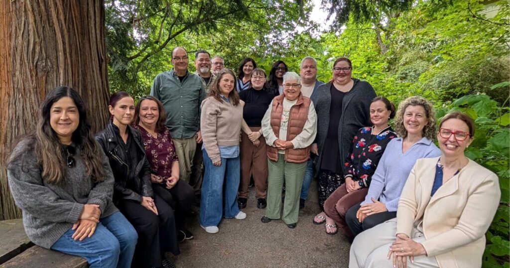 Oregon Center for Nursing 2025 Board of Directors at the annual board retreat, standing together outdoors in a group photo.